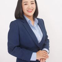 Professional woman smiling warmly with professional attire